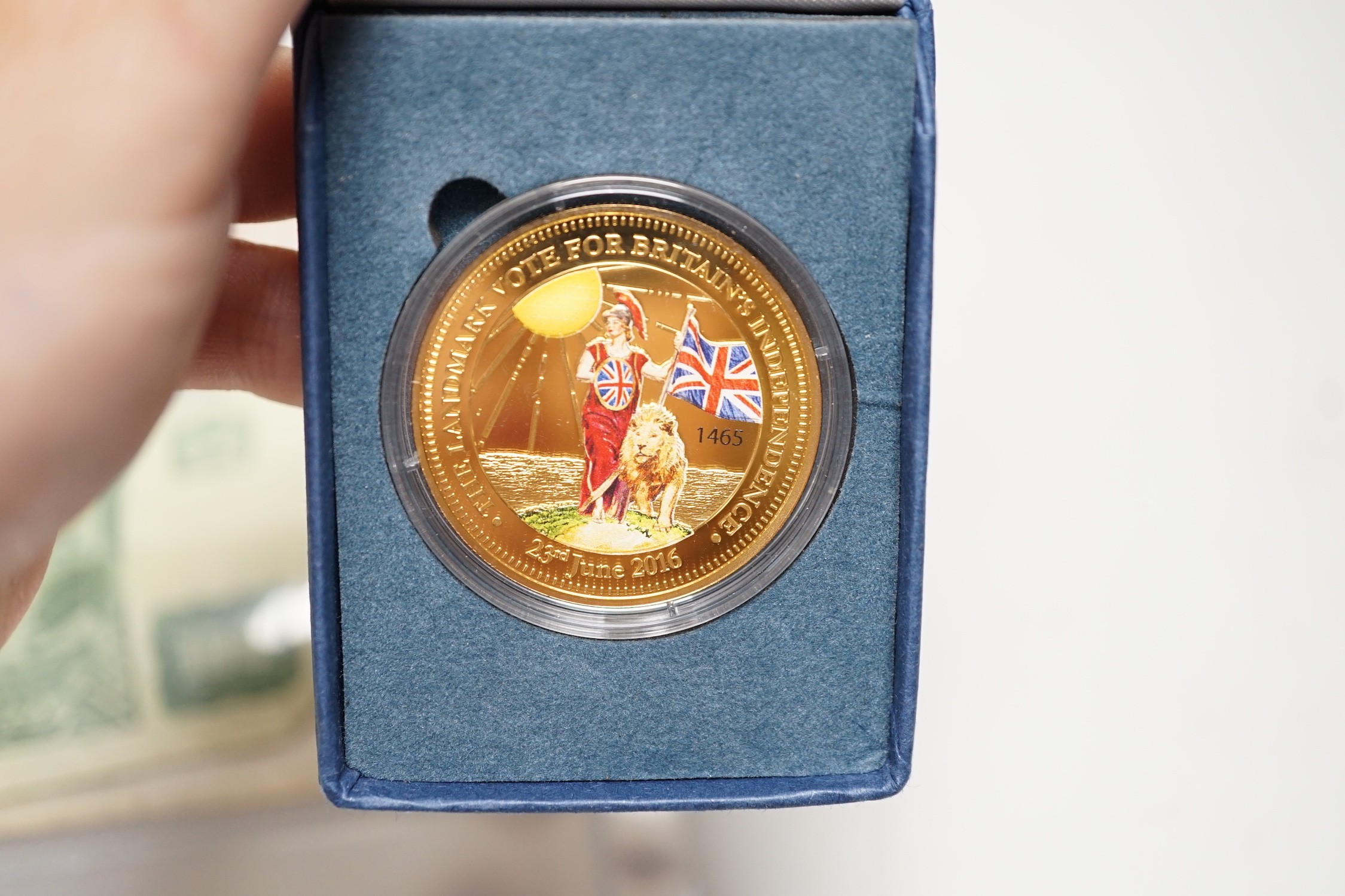 A box of UK and world coins and banknotes, a masonic steel fob seal and a Victorian brass belt buckle